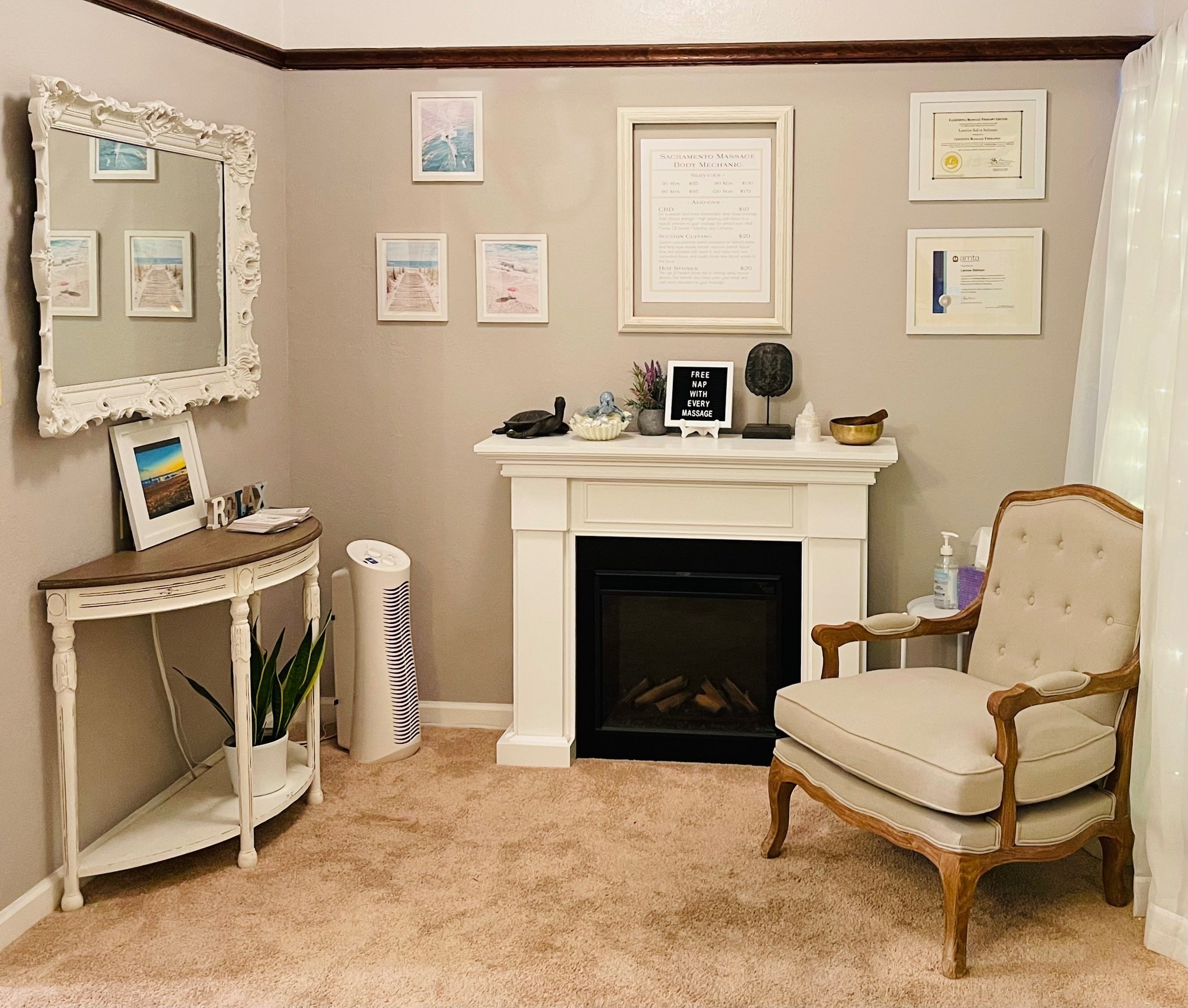Reception lounge with fireplace, vintage chair, and certifications
